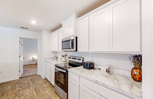 Northside House | Lake-view home with central AC, streaming, washer/dryer, patio, & full kitchen