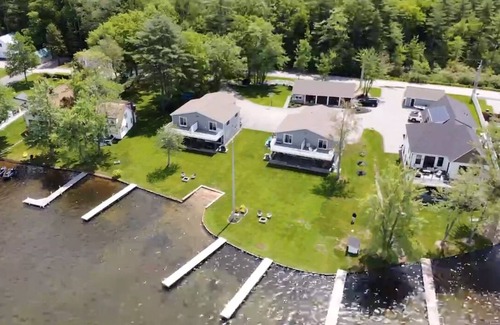 Lochmere House | Lakefront 3-bedroom Duplex on Lake Winnisquam, docks, Beach, WiFi, AC.nB2B
