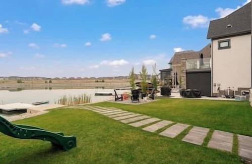 Southeast Calgary House | Lakefront | 4 Bedroom | Gym + Theatre + Garage |