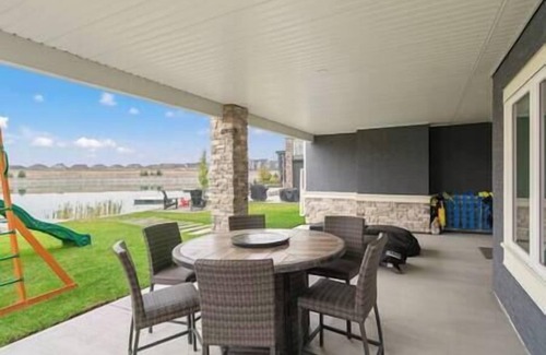 Southeast Calgary House | Lakefront | 4 Bedroom | Gym + Theatre + Garage |
