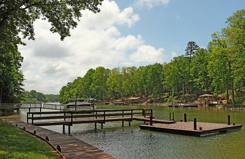 Troutman House | Lakefront Cottage located in a quiet cove with a fire-pit, kayaks & paddle board