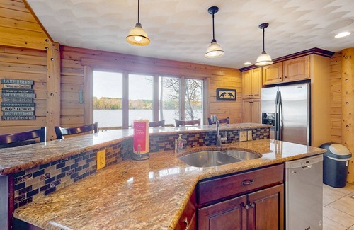Norway House | Lakefront, dog-friendly home with dock, kayaks, SUPs, canoe, huge deck & firepit