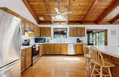 Blue Water House | Lakefront Escape with Private Docks, Three-Season Room, and Spacious Bunk Room