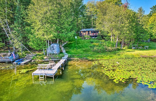 Curtis Township Cottage | Lakefront Hideaway w/Dock, Kayaks, Fire Pit!