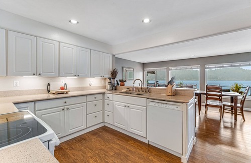 Olympia House | Lakefront home with canoe, kayaks, large deck, beach access, fireplace, & W/D