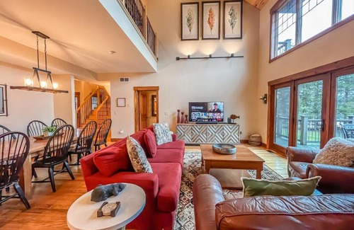 McHenry House | Lakefront home with fire pit and dock Near Wisp Resort