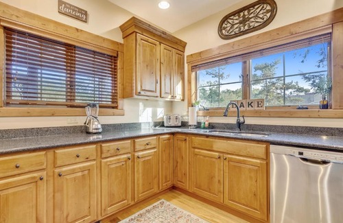 McHenry House | Lakefront home with fire pit and dock Near Wisp Resort