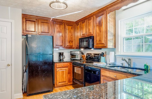 Hiawassee Cabin | Lakefront home with private hot tub, dock, 2 decks & fireplace