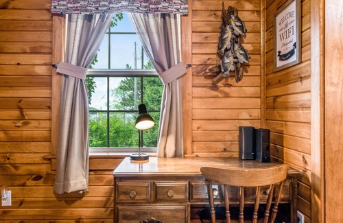 Arbor Vitae House | Lakefront home with dock, fireplace, deck, firepits & fast WiFi - dog-friendly