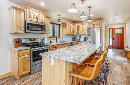 Eagle River House | Lakefront home with yard, private dock, deck, firepit, & washer/dryer