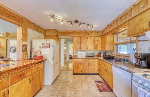 Brant Lake House | Lakefront house with 275' of waterfront, enclosed porch, & firepit