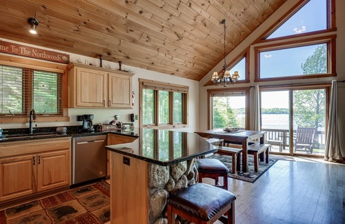 Eagle River House | Lakefront lodge with private dock, firepit, deck & sunset views