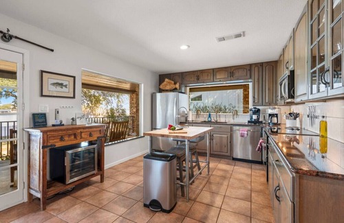 Granite Shoals House | Lakefront Retreat with Hot tub, Firepit, Dock, Lily Pad