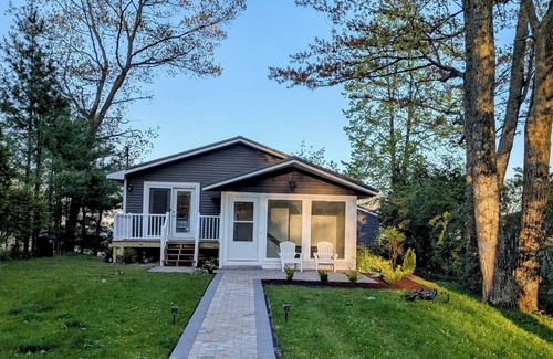 East Tawas House | Lakefront Retreat: Escape to a SANDY Pet Friendly private Lake Huron Beach!