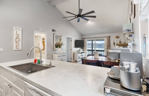 Lake Ozark Condo | Lakefront top-floor condo with grill, screened-in balcony, pool, fireplace, W/D