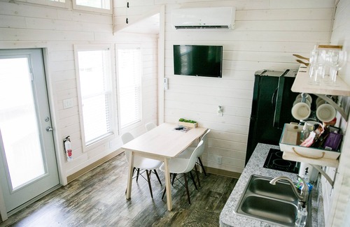 Steele Creek Cabin | Lakefront Two Bedroom Tiny Home #15 on the lake at Long Cove Resort by RedAwning