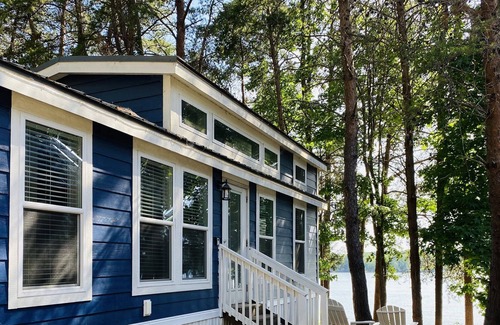 Steele Creek Cabin | Lakefront Two Bedroom Tiny Home #15 on the lake at Long Cove Resort by RedAwning