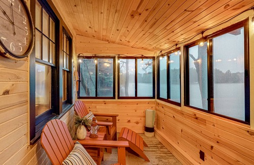 Three Lakes Cabin | Lakeside cabin with a firepit, sunroom, & seasonal dock
