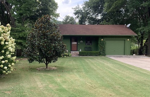 Springdale House | Lakeside house with fireplace, deck, and a fenced backyard with firepit.