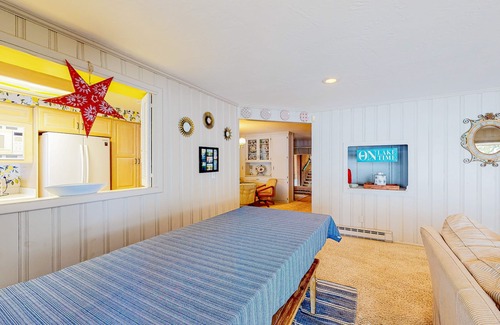 Clarksville House | Lakeside retreat with a dock, firepit, grill, board games, jetted tub, and W/D
