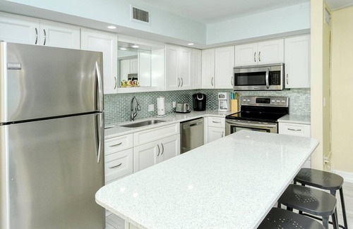 Longboat Key Apartment | LaPlaya 103A-Time to relax! Enjoy the peaceful, private beach just a shell's throw from your door.