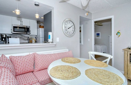 Longboat Key Apartment | LaPlaya 202E-Catch the gentle Gulf breezes on your private balcony beneath the swaying palms.
