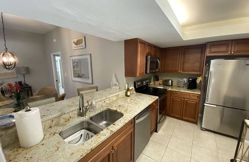 Bonita Bay Condo | LARGE 3RD. FLOOR CORNER UNIT W/GOLF COURSE VIEWS FROM SPACIOUS WRAP AROUND LANAI