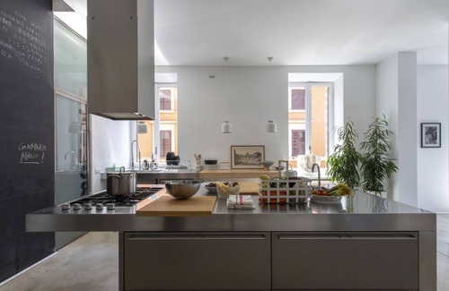 Esquilino Apartment | Large and bright 200sqm apartment, able to accommodate up to 7 people, located on the 3rd floor with elevator (not suitable for disabled people) of a building dating back to the 19th century. The property overlooks Piazza Fanti's garden and is located in