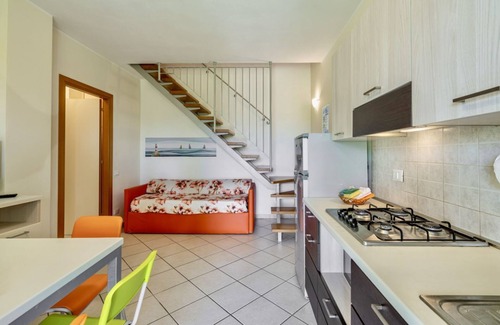 Vada Apartment | Large apartment on two levels of 61 m2 composed on the ground floor of a living room with satellite TV, equipped kitchenette, fridge with freezer, microwave oven and dishwasher.Double bedroom, double sofa bed and bathroom.On the first floor we find a bed