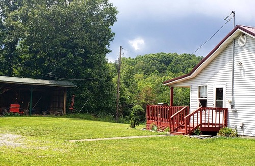 Langsville House | Large Farm Cabin with Private Pond in the middle of Cow Fields & Wildflowers