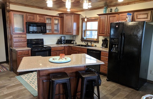 Lake Shore Cabin | Large lake front cabin, has 2 kitchens and comes with a pontoon! Bring the fam!