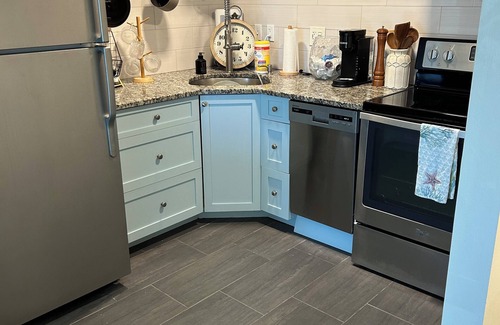 Vanderbilt Beach Condo | Large Updated Studio, 5 minute walk to Beach w/Captained Boat Time, Marina View