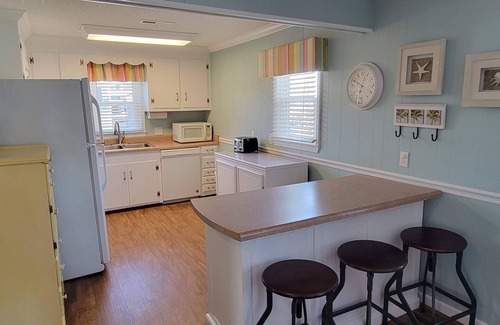 North Myrtle Beach House | Large yard with water access & floating dock/kayak launch. One block from beach