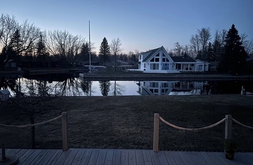 Prudenville Cottage | Lazy Waves Lodge, A waterfront canal cottage retreat on Houghton Lake