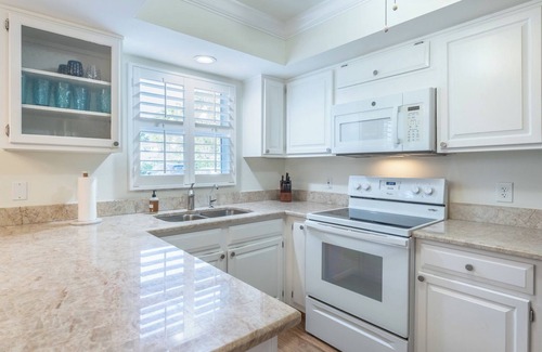 Moorings Condo | Less than 2 miles to the beach! West of 41 condo with pool and hot tub!