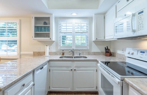 Moorings Condo | Less than 2 miles to the beach! West of 41 condo with pool and hot tub!