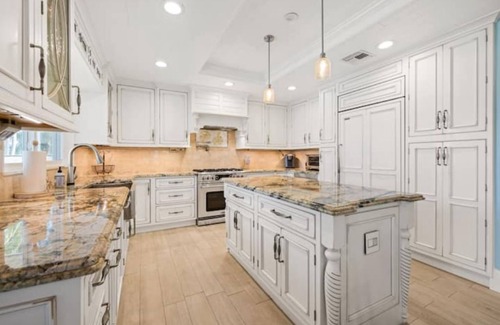 Palm City House | Light House Point Canal Front Pool Home with Dock and Ice Machine
