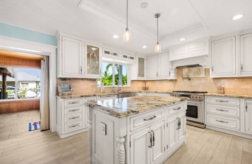 Palm City House | Light House Point Canal Front Pool Home with Dock and Ice Machine
