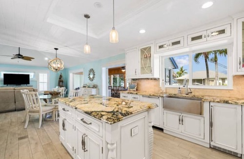 Palm City House | Light House Point Canal Front Pool Home with Dock and Ice Machine