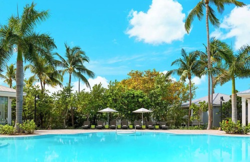 New Town Hotel | Live the Island Life | Pool, Lawn Games, Cabanas & Karaoke Nights