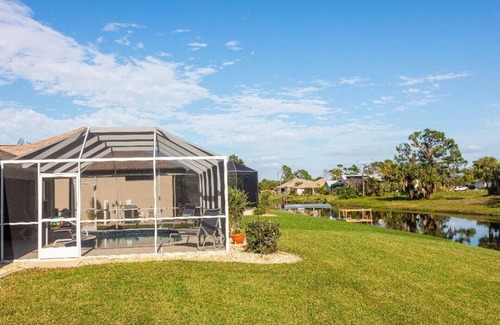 Long Meadow House | Living the tropical dream in this beautiful 3-bedroom canal oasis in SW Florida.