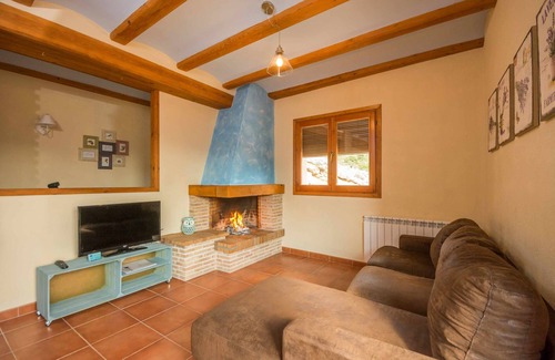 Beceite Apartment | Lo Tossal II. fireplace and terrace