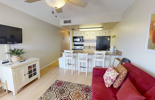 Sunset Beach Condo | Location, Location. Charming Beachside Condo. Pool, Deck Overlooking the Bay.