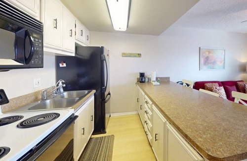 Sunset Beach Condo | Location, Location. Charming Beachside Condo. Pool, Deck Overlooking the Bay.