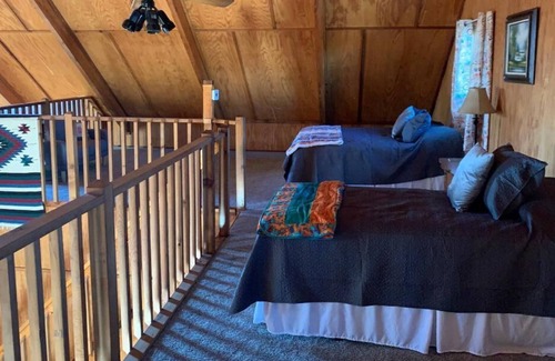Calico Rock House | Lockie Lodge, rustic A frame style home with open concept.