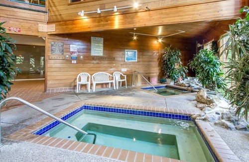 Wildernest Condo | Lofty condo with beautiful mountain & lake views plus wood fireplace