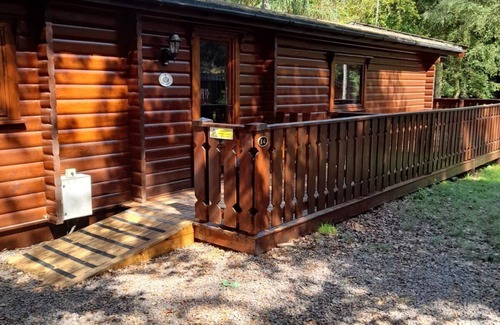 Kenwick Cabin | Log cabin with decked veranda, nestled in Kenwick Park, Louth