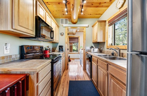 Lead House | Log cabin with private hot tub, fireplaces, decks & game room - near golf course