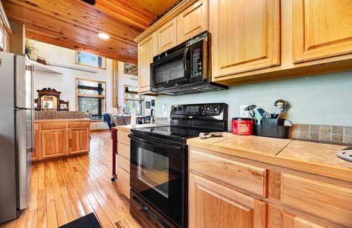 Lead House | Log cabin with private hot tub, fireplaces, decks & game room - near golf course