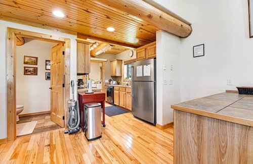 Lead House | Log cabin with private hot tub, fireplaces, decks & game room - near golf course